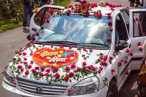 car decorated with rose flowers - indian wedding, decorated car, flowers, indian wedding, just married, red, roses, sign, tata indica, tata motors, tola gunth, white