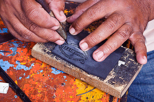 carving a rubber stamp, cutter, etching, hands, rubber stamp, street merchant, street seller, street vendor