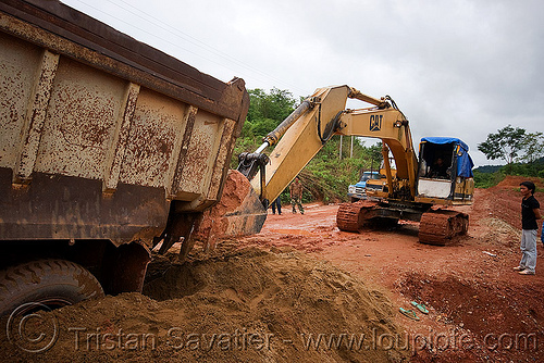 caterpillar cat e200b excavator - truck getting a lift from an excavator (laos), at work, cat e200b, caterpillar e200b, dirt road, excavator, lorry, mud, ruts, truck, unpaved, working