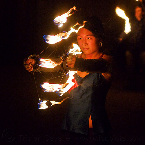 chinese woman spinning fire fans - mel, fire dancer, fire dancing, fire fans, fire performer, fire spinning, hands, mel, night, woman