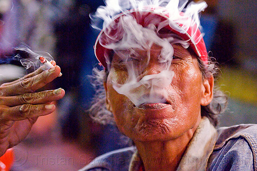 cigarette smoking man blowing smoke (indonesia), cap, cigarette, exhaling, hand, malioboro, man, night, rickshaw driver, smoke, smoker, smoking