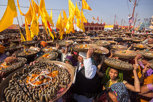 clay shiva lingas hindu offerings - procession at kumbh mela (india), carrying on the head, clay, crowd, hindu ceremony, hindu pilgrimage, hinduism, kumbh mela, lingams, offerings, shiva linga, shiva lingam, shivling, trays, walking, yellow flags