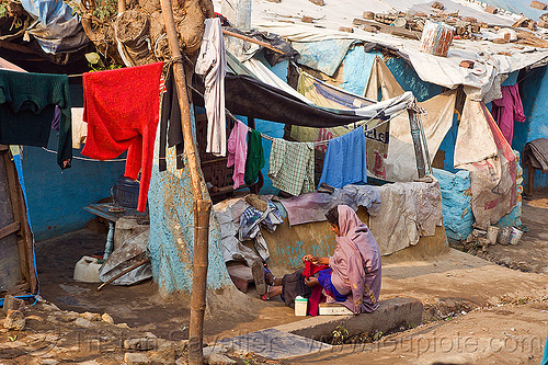 cloth lines (india), cloth lines, shanty house, shanty town, single story house, sitting, village, woman