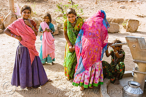 country girls pumping water - hand pump - near udaipur (india), girls, hand pump, saris, udaipur, water pump