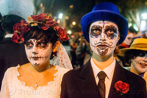couple with sugar skull makeup - dia de los muertos (san francisco), day of the dead, dia de los muertos, face painting, facepaint, flower headdress, flowers, halloween, hat, night, sugar skull makeup, women