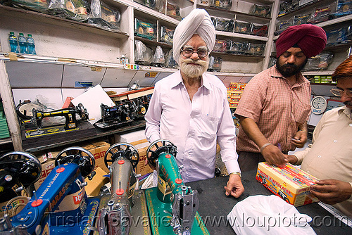 crank sewing machines - shop - delhi (india), beard, crank sewing machine, delhi, headdress, headwear, indian man, men, merchant, paras, selling, sewing machines, shop, sikh man, sikhism, turban, vendor