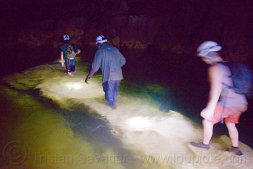 crossing the river on a underwater natural bridge - clearwater cave - mulu (borneo), borneo, cavers, caving, clearwater cave system, clearwater connection, clearwater river, fording, gunung mulu national park, malaysia, natural bridge, natural cave, river cave, river crossing, roland, spelunkers, spelunking, underground river, underwater bridge, wading