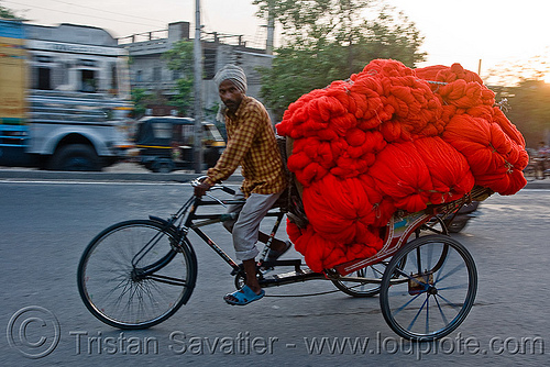 cycle rickshaw with a load of red wool (india), cycle rickshaw, freight, load, man, moving, red, skeins, trike, wallah, wool