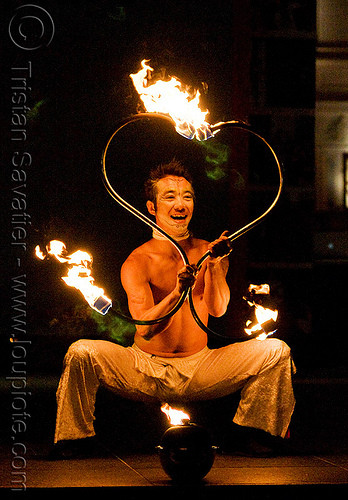 dai zaobab with s-shaped fire staves - japanese fire performer - temple of poi 2009 fire dancing expo - union square (san francisco), dai zaobab, fire dancer, fire dancing expo, fire performer, fire spinning, fire staffs, fire staves, man, night, spinning fire, temple of poi