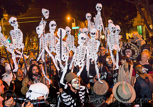 dancing paper skeleton puppets, crowd, dancing skeletons, day of the dead, dia de los muertos, halloween, music, musicians, night, paper skeleton puppets, paper skeletons