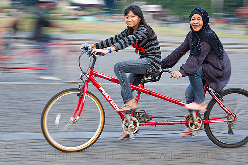 daughter and mother riding tandem, child, family, girl, jakarta, kid, man, medan merdeka, merdeka square, moving, park, riding, road, tandem bicycle, tandem bike, woman