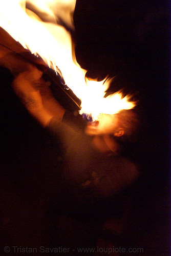 eric eating fire (san francisco), eating fire, fire dancer, fire dancing, fire eater, fire eating, fire performer, fire spinning, night, spinning fire