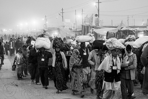 exodus - hindu pilgrims walking with luggage on their head - kumbh mela (india), bags, bundles, carrying on the head, crowd, exodus, hindu pilgrimage, hinduism, kumbh mela, luggage, men, night, walking, women