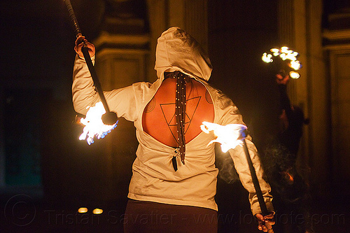 fire dancer with back tattoo, back tattoo, double staff, fire dancer, fire dancing, fire performer, fire spinning, fire staffs, mel, night, staves, tattooed, tattoos, triangle tattoo, triangles tattoo, woman