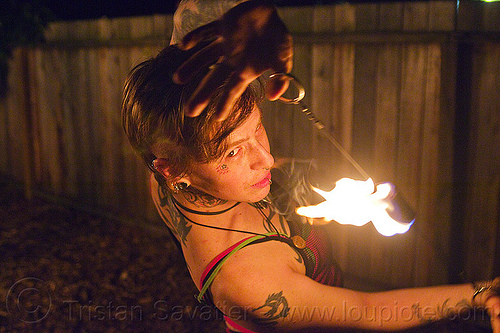 fire performer with fire doohickey, fire dancer, fire dancing, fire doohickey, fire performer, fire spinning, leah, night, woman