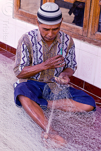 fisherman repairing fishnet - tamansarari village near probolingo (java), fisherman, fishing net, fixing, hat, man, repairing, sitting, tamansari, working