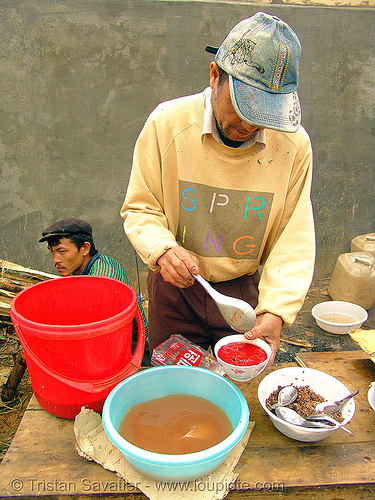 food at the market - vietnam, bowls, breakfast, coagulated blood, dishes, duck blood, food, hill tribes, indigenous, man, merchant, mèo vạc, poultry, raw blood soup, red, tiet canh, tiết canh, vendor