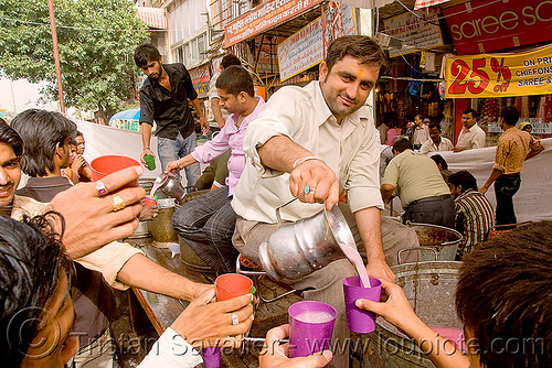 free pink drinks - hindu holiday - delhi (india), delhi, free drinks, hands, jar, pink, pitcher, plastic cups, pouring