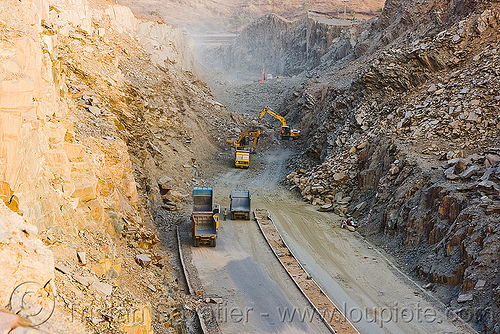freeway construction through rocky terrain near udaipur (india), at work, excavator, freeway construction, groundwork, road construction, roadworks, trucks, udaipur, working
