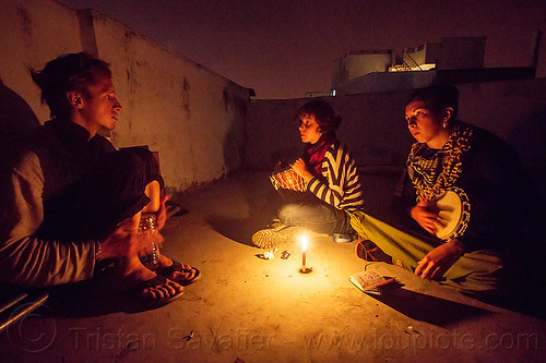friends sitting around candle (india), candle, djembe drum, drummer, drumming, malou, night, pierrot, sitting, varanasi, women