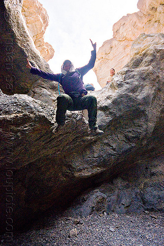 fun times in grotto canyon, dana, death valley, grotto canyon, jump, jumper, jumping down, jumpshot, mountain, peace sign, rock, slot canyon, v sign, victory sign, woman