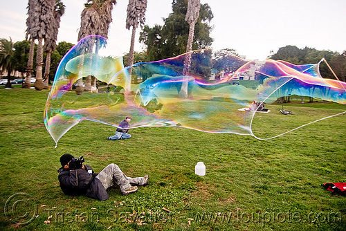 giant soap bubble, big bubble, giant bubble, iridescent, lawn, park, photographer, soap bubbles