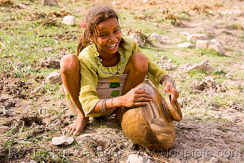 girl cleaning water jar - mandu (india), girl, mandav, mandu, water jar, water pot