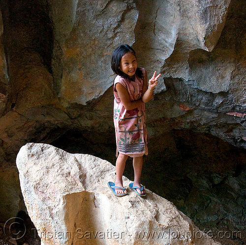 girl on rock (laos), girl, peace sign, rock, v sign, viang xai, victory sign