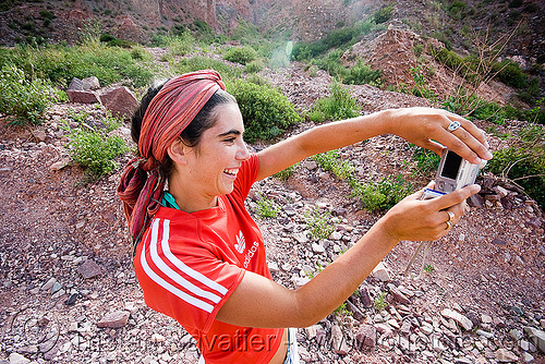 girl taking photo - pilar pitòn, adidas, argentina, digital camera, head-band, iruya, noroeste argentino, pilar, quebrada de humahuaca, red, taking photo, woman