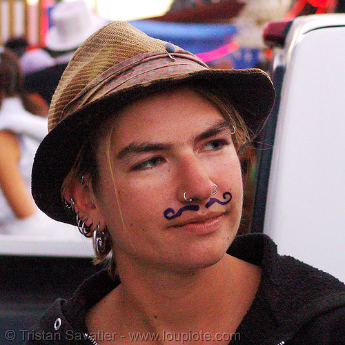 girl with moustache - padawan (from dpw) - burning man decompression, ear piercing, hat, jewelry, mustache, nose piercing, nostril piercing, padawan, woman
