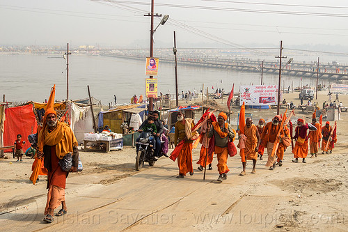 group of hindu pilgrims walking - kumbh mela 2013 (india), babas, bhagwa, floating bridge, foot bridge, ganga, ganges river, group, hindu pilgrimage, hinduism, kumbh mela, men, pilgrims, pontoon bridge, river bank, sadhu, saffron color, walking