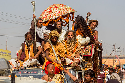 guru and his devotees on top of jeep - kumbh mela (india), beard, float, gurus, hindu pilgrimage, hinduism, kumbh maha snan, kumbh mela, mauni amavasya, men, parade, umbrella