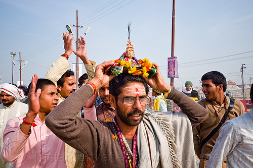 hare krishna devotee holding deity statue over his head - kumbh mela 2013 (india), ceremony, dancing, hare krishna, hindu pilgrimage, hinduism, kumbh mela, men, paush purnima, tilak, tilaka