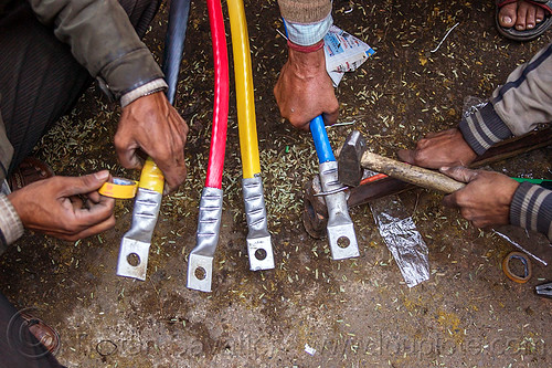 high voltage cables and connectors, connectors, delhi, electric, electrical tape, electricity, hammer, hammering, hands, high voltage, power cables, workers, working