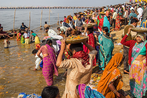 hindu devotees bring clay shiva linga's offerings to the ganges river (india), carrying on the head, clay, crowd, ganga, ganges river, hindu ceremony, hindu pilgrimage, hinduism, kumbh mela, lingams, offerings, river bank, shiva linga, shiva lingam, shivling, trays, walking