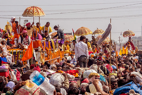 hindu guru parade - massive traffic jam in crowded street - kumbh mela (india), crowd, float, gurus, hindu pilgrimage, hinduism, kumbh maha snan, kumbh mela, mauni amavasya, parade, umbrellas