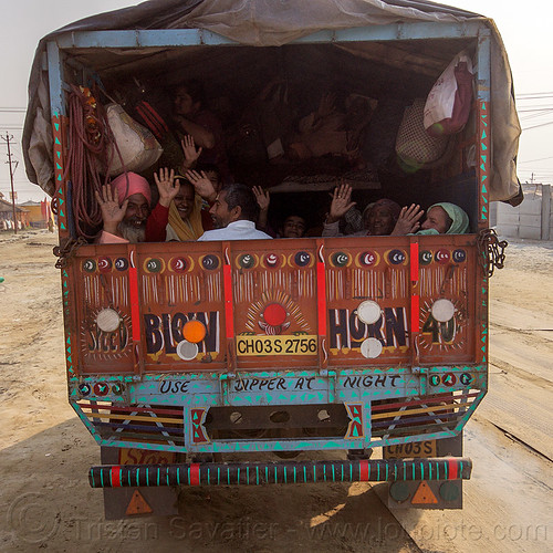 hindu pilgrims in back of truck - kumbh mela (india), exodus, hands, hindu pilgrimage, hinduism, kumbh mela, lorry, truck