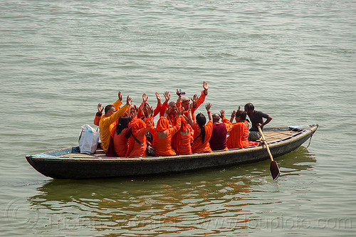 hindu pilgrims on boat on the ganges river, waving hands (varanasi), bhagwa, ganga, ganges river, hands, hindu, hinduism, pilgrims, river boat, rowing boat, saffron color, small boat, varanasi, waving