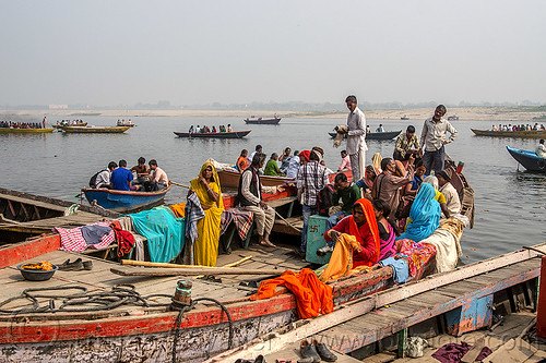 hindu pilgrims on river boats - varanasi (india), ganga, ganges river, ghats, hindu, hinduism, indian women, men, moored, river boats, sarees, saris, sitting, varanasi