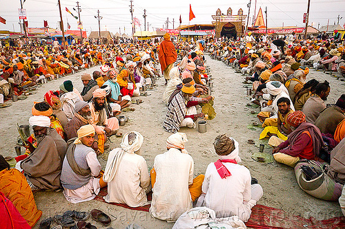 hindu pilgrims sitting in rows, waiting for holy prasad - kumbh mela 2013 (india), ashram, crowd, eating, food, hindu pilgrimage, hinduism, holy prasad, kumbh mela, men, pilgrims, rows, sitting
