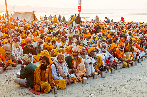 hindu pilgrims waiting for holy prasad - kumbh mela 2013 (india), ashram, crowd, dinner, eating, food, hindu pilgrimage, hinduism, holy prasad, kumbh mela, men, pilgrims, rows, sitting