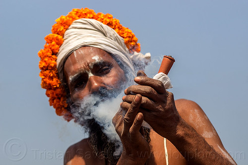 hindu sadhu smoking ritual ganja with chillum (india), baba smoking chillum, chillum pipe, ganja, headwear, hindu pilgrimage, hinduism, kumbh maha snan, kumbh mela, man, mauni amavasya, sadhu, smoke, smoking pipe, smoking weed