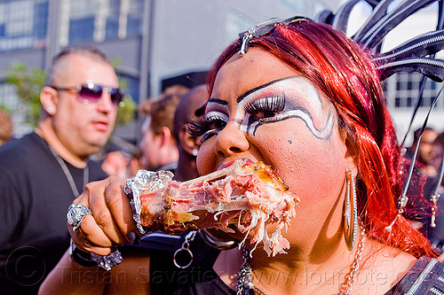 holy mcgrail eating barbecued turkey drumstick, barbecued, bbq, bio drag-queen, bio queen, cooked meat, cooked turkey, drag queen, eating, faux queen, finger food, holy mcgrail, makeup, red hair, snack, street food, turkey drumstick, turkey leg, turkey meat, woman