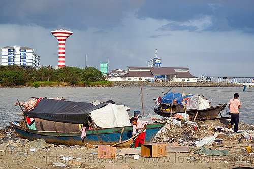 homeless living on boats, borneo, encampment, garbage, homeless camp, lahad datu, malaysia, ocean, poor, sea, seashore, small boats, trash, wasteland, water tower