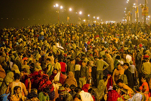 huge crowd of hindu pilgrims near sangam - kumbh mela 2013, crowd, hindu pilgrimage, hinduism, kumbh mela, men, night, paush purnima, pilgrims, street lights, triveni sangam, women