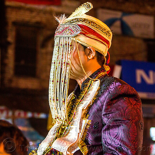 indian groom with fringes hat at his wedding (india), bank notes, costume, embroidery, fly fringes, fringes veil, groom, hat, headdress, indian man, money, night, rishikesh, wedding