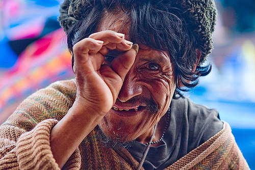 indigenous man looking through fingers (bolivia), bolivia, fingers, hand, indigenous, looking, man, quechua, tarabuco