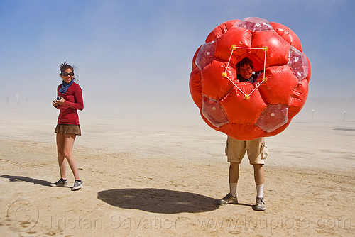 inflatable giant soccer ball, art installation, inflatable art, man, woman