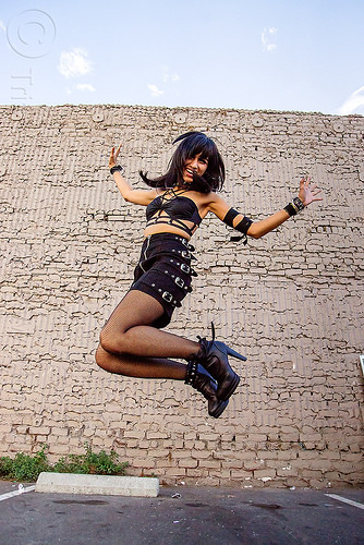 jumping girl - folsom street fair 2015 (san francisco), brick wall, buckles, high heel, jump, jumpshot, woman