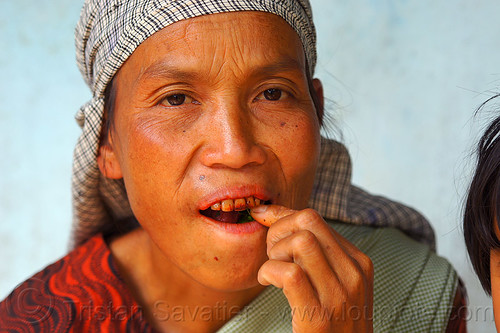 khasi woman chewing betel nut quids (india), areca nut, betel leaf, betel nut, betel quids, betelnut teeth, east khasi hills, indian woman, indigenous, mawlynnong, meghalaya
